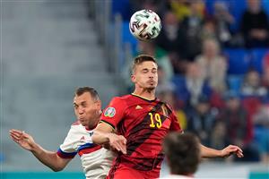 Russia's forward Artem Dzyuba (L) and Belgium's midfielder Leander Dendoncker jump to head the ball during the UEFA EURO 2020 Group B football match between Belgium and Russia at the Saint Petersburg Stadium in Saint Petersburg on June 12, 2021. (Getty Images)