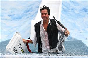 MELBOURNE, AUSTRALIA - JUNE 14: Gil McLachlan the AFL CEO goes down the slide during the Big Freeze slide at Melbourne Cricket Ground on June 14, 2021 in Melbourne, Australia. The annual event aims to raise funds to fight MND as part of the Queen's Birthday AFL match, this year held at the SCG due to Covid19 protocols in Melbourne preventing crowd from attending this year's event. (Photo by Quinn Rooney/Getty Images)