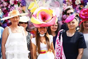 ASCOT, ENGLAND - JUNE 15: Racegoers poses for a photo on Day One of the Royol Ascot Meeting at Ascot Racecourse on June 15, 2021 in Ascot, England. A total of twelve thousand racegoers made up of Owners and the Public are permitted to attend the meeting due to it being an Events Research Programme (ERP) set up by the government due to the Coronavirus Pandemic. (Photo by Harry Trump/Getty Images)
