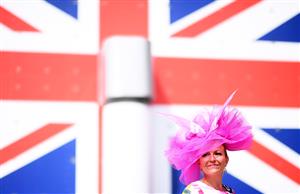 ASCOT, ENGLAND - JUNE 15: A racegoer poses for a photo on Day One of the Royol Ascot Meeting at Ascot Racecourse on June 15, 2021 in Ascot, England. A total of twelve thousand racegoers made up of Owners and the Public are permitted to attend the meeting due to it being an Events Research Programme (ERP) set up by the government due to the Coronavirus Pandemic. (Photo by Harry Trump/Getty Images)