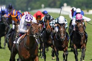 ASCOT, ENGLAND - JUNE 15: Kevin Manning riding Poetic Flare (L, white) easily win The St James's Palace Stakes on day one of the Royal Ascot meeting at Ascot Racecourse on June 15, 2021 in Ascot, England. A total of twelve thousand racegoers made up of owners and the public are permitted to attend the meeting due to it being an Events Research Programme (ERP) set up by the Government due to the Coronavirus pandemic. (Photo by Alan Crowhurst/Getty Images)