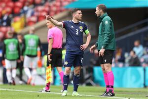 Scotland's defender Andrew Robertson (C) talks with a assistant referee during the UEFA EURO 2020 Group D football match between Scotland and Czech Republic at Hampden Park in Glasgow on June 14, 2021. (Getty Images)