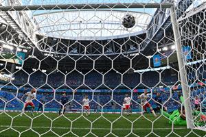 TOPSHOT - Slovakia's forward Robert Mak shoots and Poland's goalkeeper Wojciech Szczesny scores an own goal during the UEFA EURO 2020 Group E football match between Poland and Slovakia at the Saint Petersburg Stadium in Saint Petersburg on June 14, 2021. (Getty Images)