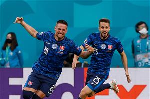Slovakia's forward Robert Mak (L) celebrates after scoring his team's first goal during the UEFA EURO 2020 Group E football match between Poland and Slovakia at the Saint Petersburg Stadium in Saint Petersburg on June 14, 2021. (Getty Images)