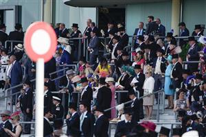 ASCOT, ENGLAND - JUNE 15: Racegoers wait for the start of race one on day one of the Royal Ascot meeting at Ascot Racecourse on June 15, 2021 in Ascot, England. A total of twelve thousand racegoers made up of owners and the public are permitted to attend the meeting due to it being an Events Research Programme (ERP) set up by the Government due to the Coronavirus pandemic. (Photo by Alan Crowhurst/Getty Images)