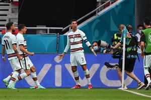 TOPSHOT - Portugal's forward Cristiano Ronaldo celebrates scoring his team's second goal after a penalty kick during the UEFA EURO 2020 Group F football match between Hungary and Portugal at the Puskas Arena in Budapest on June 15, 2021. (Getty Images)