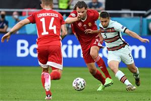 Hungary's forward Adam Szalai (C) vies with Portugal's defender Raphael Guerreiro during the UEFA EURO 2020 Group F football match between Hungary and Portugal at the Puskas Arena in Budapest on June 15, 2021. (Getty Images)
