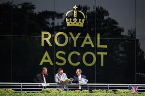 ASCOT, ENGLAND - JUNE 15: Race-goers study the odds ahead of the first race at Ascot Racecourse on June 15, 2021 in Ascot, England. 12,000 spectators are being allowed to attend each day of the five-day meeting, with racegoers providing negative Covid-19 tests to gain admission. (Photo by Leon Neal/Getty Images)