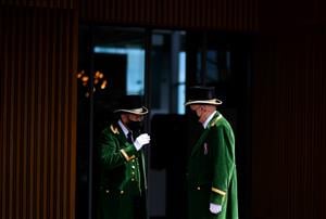 ASCOT, ENGLAND - JUNE 16: The Green Coats interact on Day Two of the Royal Ascot Meeting at Ascot Racecourse on June 16, 2021 in Ascot, England. A total of twelve thousand racegoers made up of Owners and the Public are permitted to attend the meeting due to it being an Events Research Programme (ERP) set up by the government due to the Coronavirus Pandemic. (Photo by Harry Trump/Getty Images)