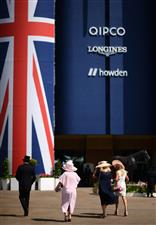 ASCOT, ENGLAND - JUNE 16: Racegoers look on on Day Two of the Royal Ascot Meeting at Ascot Racecourse on June 16, 2021 in Ascot, England. A total of twelve thousand racegoers made up of Owners and the Public are permitted to attend the meeting due to it being an Events Research Programme (ERP) set up by the government due to the Coronavirus Pandemic. (Photo by Harry Trump/Getty Images)