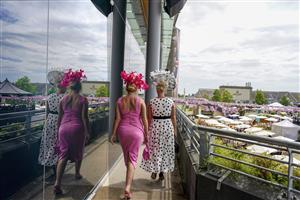 ASCOT, ENGLAND - JUNE 16: A general view as two ladies make their way into the grandstand on Day Two of the Royal Ascot Meeting at Ascot Racecourse on June 16, 2021 in Ascot, England. A total of twelve thousand racegoers made up of owners and the public are permitted to attend the meeting due to it being an Events Research Programme (ERP) set up by the Government due to the Coronavirus pandemic. (Photo by Alan Crowhurst/Getty Images)