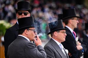 ASCOT, ENGLAND - JUNE 15: Race-goers watch the second race of the day at Ascot Racecourse on June 15, 2021 in Ascot, England. 12,000 spectators are being allowed to attend each day of the five-day meeting, with racegoers providing negative Covid-19 tests to gain admission. (Photo by Leon Neal/Getty Images)