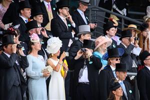 ASCOT, ENGLAND - JUNE 15: Race-goers watch the second race of the day at Ascot Racecourse on June 15, 2021 in Ascot, England. 12,000 spectators are being allowed to attend each day of the five-day meeting, with racegoers providing negative Covid-19 tests to gain admission. (Photo by Leon Neal/Getty Images)