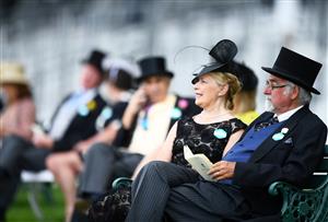 ASCOT, ENGLAND - JUNE 15: Racegoer look on ahead of the first race on Day One of the Royol Ascot Meeting at Ascot Racecourse on June 15, 2021 in Ascot, England. A total of twelve thousand racegoers made up of Owners and the Public are permitted to attend the meeting due to it being an Events Research Programme (ERP) set up by the government due to the Coronavirus Pandemic. (Photo by Harry Trump/Getty Images)