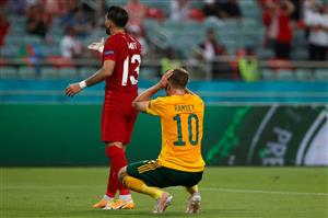 Turkey's defender Umut Meras (TOP) and Wales' midfielder Aaron Ramsey react during the UEFA EURO 2020 Group A football match between Turkey and Wales at the Olympic Stadium in Baku on June 16, 2021. (Getty Images)