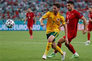 Wales' midfielder Joe Allen and Turkey's defender Zeki Celik look at the ball during the UEFA EURO 2020 Group A football match between Turkey and Wales at the Olympic Stadium in Baku on June 16, 2021. (Getty Images)