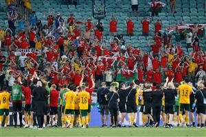Wales' players celebrate their victory in front of fans at the end of the UEFA EURO 2020 Group A football match between Turkey and Wales at the Olympic Stadium in Baku on June 16, 2021. (Getty Images)