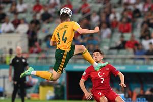 Wales' defender Connor Roberts (L) heads the ball in front of Turkey's midfielder Cengiz Under during the UEFA EURO 2020 Group A football match between Turkey and Wales at the Olympic Stadium in Baku on June 16, 2021. (Getty Images)