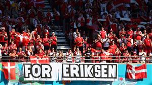 Denmark's supporters hold a banner in support of Denmark's midfielder Christian Eriksen before the start of the UEFA EURO 2020 Group B football match between Denmark and Belgium at the Parken Stadium in Copenhagen on June 17, 2021. (Getty Images)