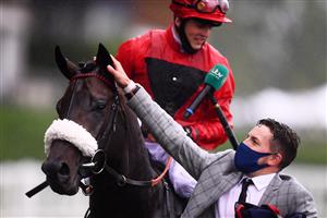 ASCOT, ENGLAND - JUNE 18: Clifford Lee celebrates on board Significantly with the groom after winning the Palace Of Holyroodhouse Stakes on Day Four of the Royal Ascot Meeting at Ascot Racecourse on June 18, 2021 in Ascot, England. A total of twelve thousand racegoers made up of Owners and the Public are permitted to attend the meeting due to it being an Events Research Programme (ERP) set up by the government due to the Coronavirus Pandemic. (Photo by Harry Trump/Getty Images)
