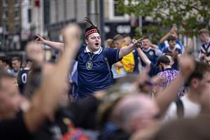 LONDON, ENGLAND - JUNE 17: Scotland fans singing outside King's Cross Station on June 17, 2021 in London, England. Officials in Scotland and London, where the match will be hosted at Wembley Stadium, have discouraged Scottish fans without tickets to the game of coming south, due to concerns about the spread of Covid-19. (Getty Images)