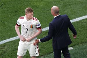 Belgium's midfielder Kevin De Bruyne (L) speaks with Belgium's Spanish coach Roberto Martinez during the UEFA EURO 2020 Group B football match between Denmark and Belgium at the Parken Stadium in Copenhagen on June 17, 2021. (Getty Images)