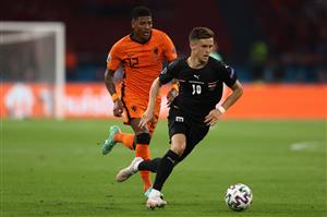 Netherlands' defender Patrick van Aanholt (L) challenges Austria's midfielder Christoph Baumgartner during the UEFA EURO 2020 Group C football match between the Netherlands and Austria at the Johan Cruyff Arena in Amsterdam on June 17, 2021. (Getty Images)