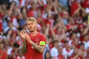 TOPSHOT - Denmark's defender Simon Kjaer claps after the ball was kicked out of play in honour of Denmark's midfielder Christian Eriksen during the UEFA EURO 2020 Group B football match between Denmark and Belgium at the Parken Stadium in Copenhagen on June 17, 2021. - Eriksen suffered a cardiac arrest during his country's Euro 2020 opener last weekend. (Getty Images)
