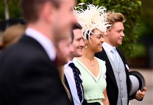 ASCOT, ENGLAND - JUNE 19: Racegoers pose for a photo on Day Five of the Royal Ascot Meeting at Ascot Racecourse on June 19, 2021 in Ascot, England. A total of twelve thousand racegoers made up of Owners and the Public are permitted to attend the meeting due to it being an Events Research Programme (ERP) set up by the government due to the Coronavirus Pandemic. (Photo by Harry Trump/Getty Images) (Photo by Harry Trump/Getty Images)