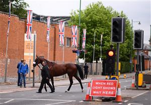 ASCOT, ENGLAND - JUNE 19: A runner crosses the road outside of the course ahead of the Chesham Stakes on Day Five of the Royal Ascot Meeting at Ascot Racecourse on June 19, 2021 in Ascot, England. A total of twelve thousand racegoers made up of Owners and the Public are permitted to attend the meeting due to it being an Events Research Programme (ERP) set up by the government due to the Coronavirus Pandemic. (Photo by Harry Trump/Getty Images) (Photo by Harry Trump/Getty Images)