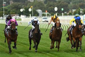 MELBOURNE, AUSTRALIA - JUNE 19: Craig Newitt (pink cap) riding Free To Move winning Race 7, the A.r. Creswick Stakes, during Melbourne Racing at Flemington Racecourse on June 19, 2021 in Melbourne, Australia. (Photo by Vince Caligiuri/Getty Images)