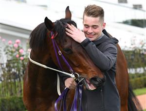 MELBOURNE, AUSTRALIA - JUNE 19: Free To Move is hugged by his strapper after winning Race 7, the A.r. Creswick Stakes, during Melbourne Racing at Flemington Racecourse on June 19, 2021 in Melbourne, Australia. (Photo by Vince Caligiuri/Getty Images)