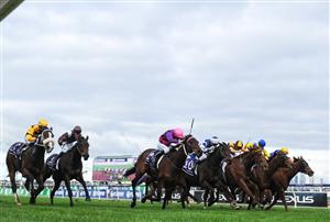 MELBOURNE, AUSTRALIA - JUNE 19: Craig Newitt (pink cap) riding Free To Move winning Race 7, the A.r. Creswick Stakes, during Melbourne Racing at Flemington Racecourse on June 19, 2021 in Melbourne, Australia. (Photo by Vince Caligiuri/Getty Images)