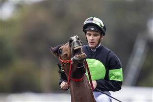 SYDNEY, AUSTRALIA - JUNE 19: Sam Clipperton on Stockman returns to scale after winning race 7 the XXXX W J Mckell Cup during Sydney Racing at Rosehill Gardens on June 19, 2021 in Sydney, Australia. (Photo by Jenny Evans/Getty Images)