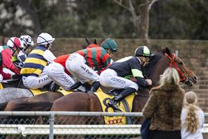 SYDNEY, AUSTRALIA - JUNE 19: People look on as Sam Clipperton on Stockman jumps from the barriers race 7 the XXXX W J Mckell Cup during Sydney Racing at Rosehill Gardens on June 19, 2021 in Sydney, Australia. (Photo by Jenny Evans/Getty Images)