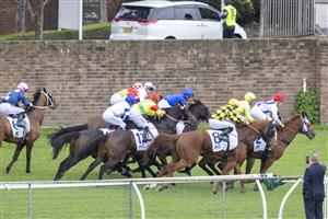 SYDNEY, AUSTRALIA - JUNE 19: James McDonald (pink cap) on No Compromise last out of the gates before winning race 4 the Acy Securities Handicap during Sydney Racing at Rosehill Gardens on June 19, 2021 in Sydney, Australia. (Photo by Jenny Evans/Getty Images)