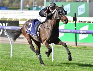 MELBOURNE, AUSTRALIA - JUNE 19: Jamie Kah riding South Pacific winning Race 2, the Adam Lindsay Gordon Handicap, during Melbourne Racing at Flemington Racecourse on June 19, 2021 in Melbourne, Australia. (Photo by Vince Caligiuri/Getty Images)