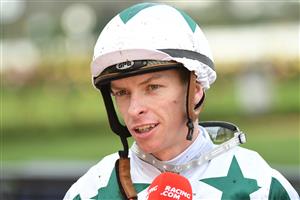MELBOURNE, AUSTRALIA - JUNE 19: Michael Dee after riding Unique Artist to win race 6, the Sir Henry Bolte Handicap, during Melbourne Racing at Flemington Racecourse on June 19, 2021 in Melbourne, Australia. (Photo by Vince Caligiuri/Getty Images)