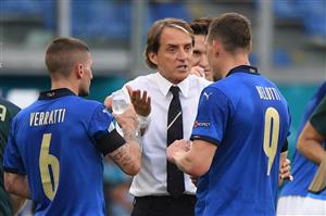 Italy's coach Roberto Mancini (C) speaks with Italy's midfielder Marco Verratti (L) and Italy's forward Andrea Belotti during the UEFA EURO 2020 Group A football match between Italy and Wales at the Olympic Stadium in Rome on June 20, 2021. (Getty Images)