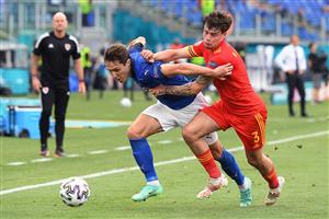 Wales' defender Neco Williams (R) vies for the ball with Italy's midfielder Federico Chiesa during the UEFA EURO 2020 Group A football match between Italy and Wales at the Olympic Stadium in Rome on June 20, 2021. (Getty Images)