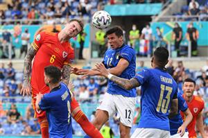 Wales' defender Joe Rodon (L) vies for the header with Italy's midfielder Matteo Pessina (C) during the UEFA EURO 2020 Group A football match between Italy and Wales at the Olympic Stadium in Rome on June 20, 2021. (Getty Images)