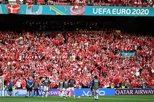 Denmark's players warm up before the start of the UEFA EURO 2020 Group B football match between Russia and Denmark at Parken Stadium in Copenhagen on June 21, 2021. (Photo by Jonathan NACKSTRAND / POOL / AFP) (Photo by JONATHAN NACKSTRAND/POOL/AFP via Getty Images)