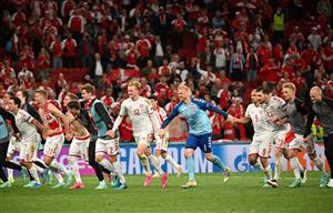 Denmark's players celebrate at the end of the UEFA EURO 2020 Group B football match between Russia and Denmark at Parken Stadium in Copenhagen on June 21, 2021. (Getty Images)