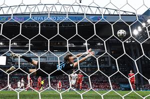 Russia's goalkeeper Matvei Safonov dives for the ball during the UEFA EURO 2020 Group B football match between Russia and Denmark at Parken Stadium in Copenhagen on June 21, 2021. (Getty Images)