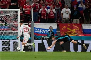 Denmark's forward Yussuf Poulsen (L) scores a goal past Russia's goalkeeper Matvei Safonov during the UEFA EURO 2020 Group B football match between Russia and Denmark at Parken Stadium in Copenhagen on June 21, 2021. (Getty Images)