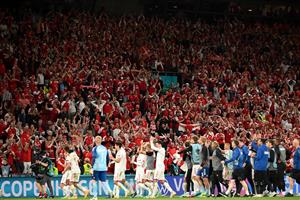 Denmark's players celebrate at the end of the UEFA EURO 2020 Group B football match between Russia and Denmark at Parken Stadium in Copenhagen on June 21, 2021. (Getty Images)