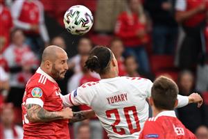 Russia's defender Fedor Kudryashov (L) fights for the ball with Denmark's forward Yussuf Poulsen during the UEFA EURO 2020 Group B football match between Russia and Denmark at Parken Stadium in Copenhagen on June 21, 2021. (Getty Images)