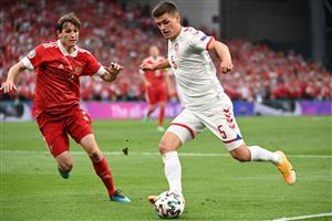 Russia's defender Mario Fernandes (L) fights for the ball with Denmark's defender Joakim Maehle during the UEFA EURO 2020 Group B football match between Russia and Denmark at Parken Stadium in Copenhagen on June 21, 2021. (Getty Images)