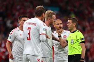 COPENHAGEN, DENMARK - JUNE 21: Simon Kjaer of Denmark speaks with Match Referee, Clement Turpin after a penalty is awarded for Russia during the UEFA Euro 2020 Championship Group B match between Russia and Denmark at Parken Stadium on June 21, 2021 in Copenhagen, Denmark. (Getty Images)