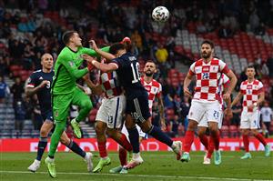 Croatia's goalkeeper Dominik Livakovic (L) punches the ball ahead of Scotland's forward Che Adams (C) during the UEFA EURO 2020 Group D football match between Croatia and Scotland at Hampden Park in Glasgow on June 22, 2021. (Getty Images)